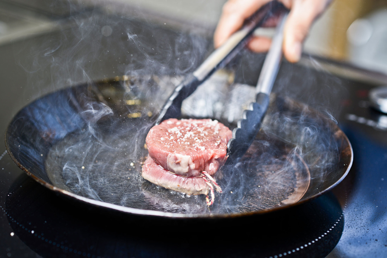 steak in an iron pan