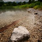 stone in quiet water