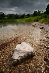 stone in quiet water