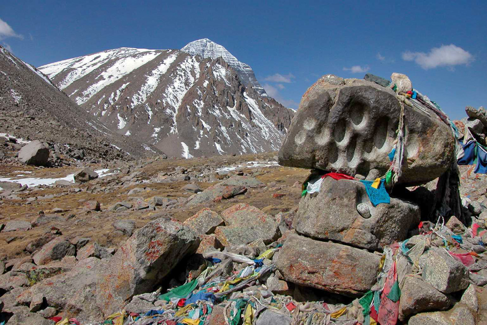 Stone pit and footprint set by Milarepa