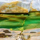 Stones and green water