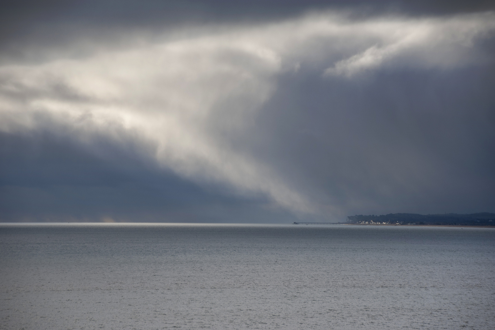 Storm Clouds over a Small Seaside Town