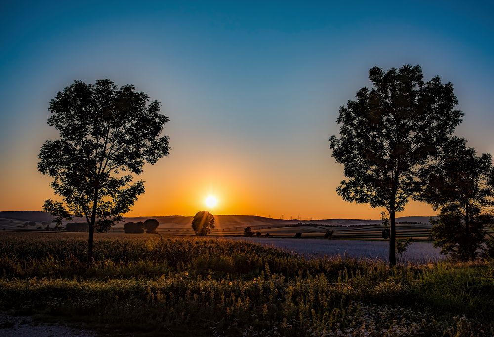Strahlen der untergehenden Sonne