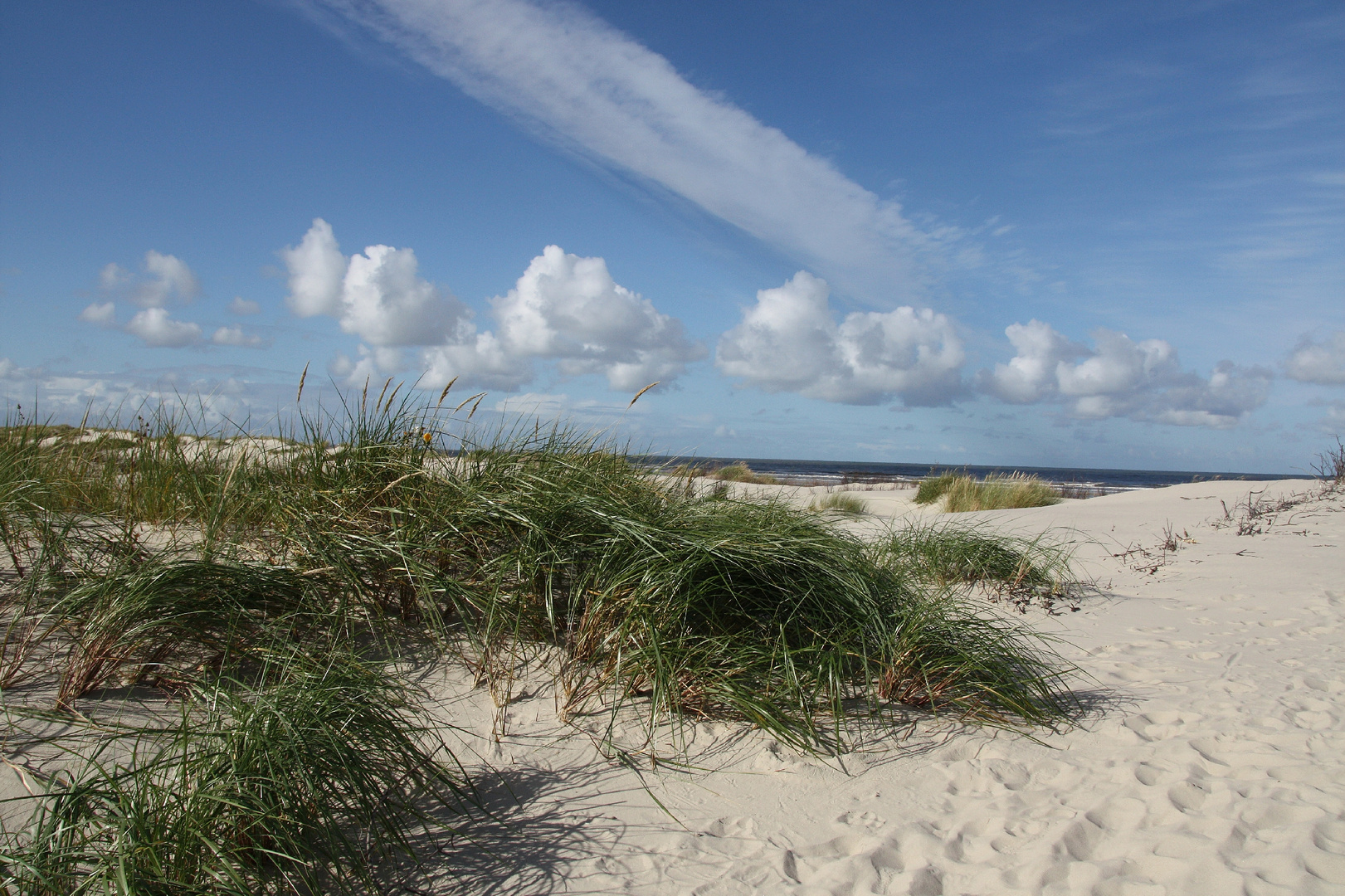 Strand und Wolken