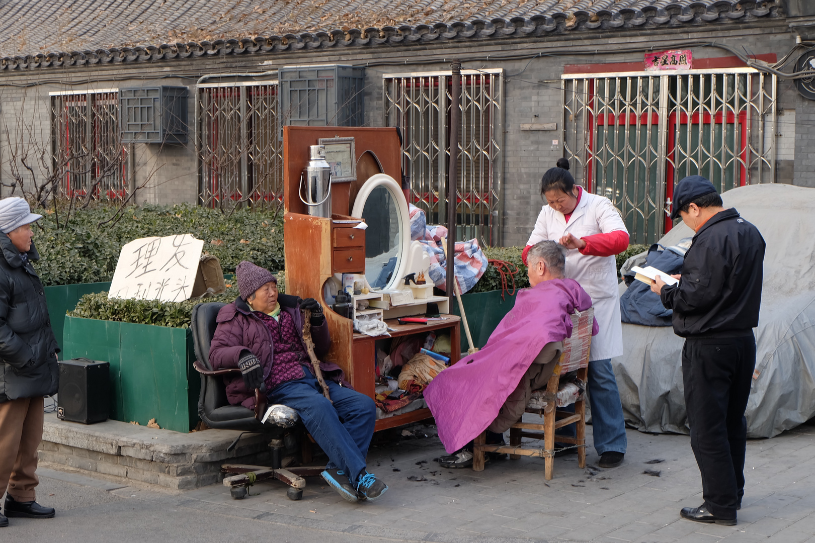 Straßenfriseur in Peking