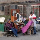 Straßenfriseur in Peking