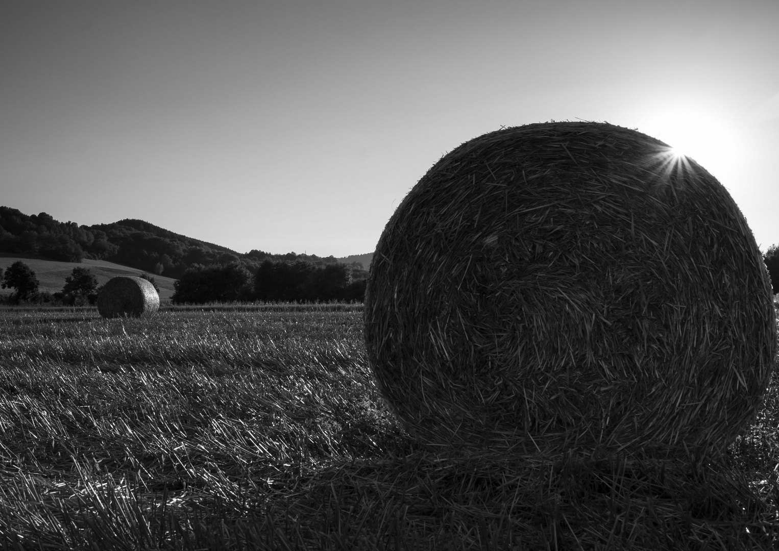 Strohballen im Sonnenuntergang