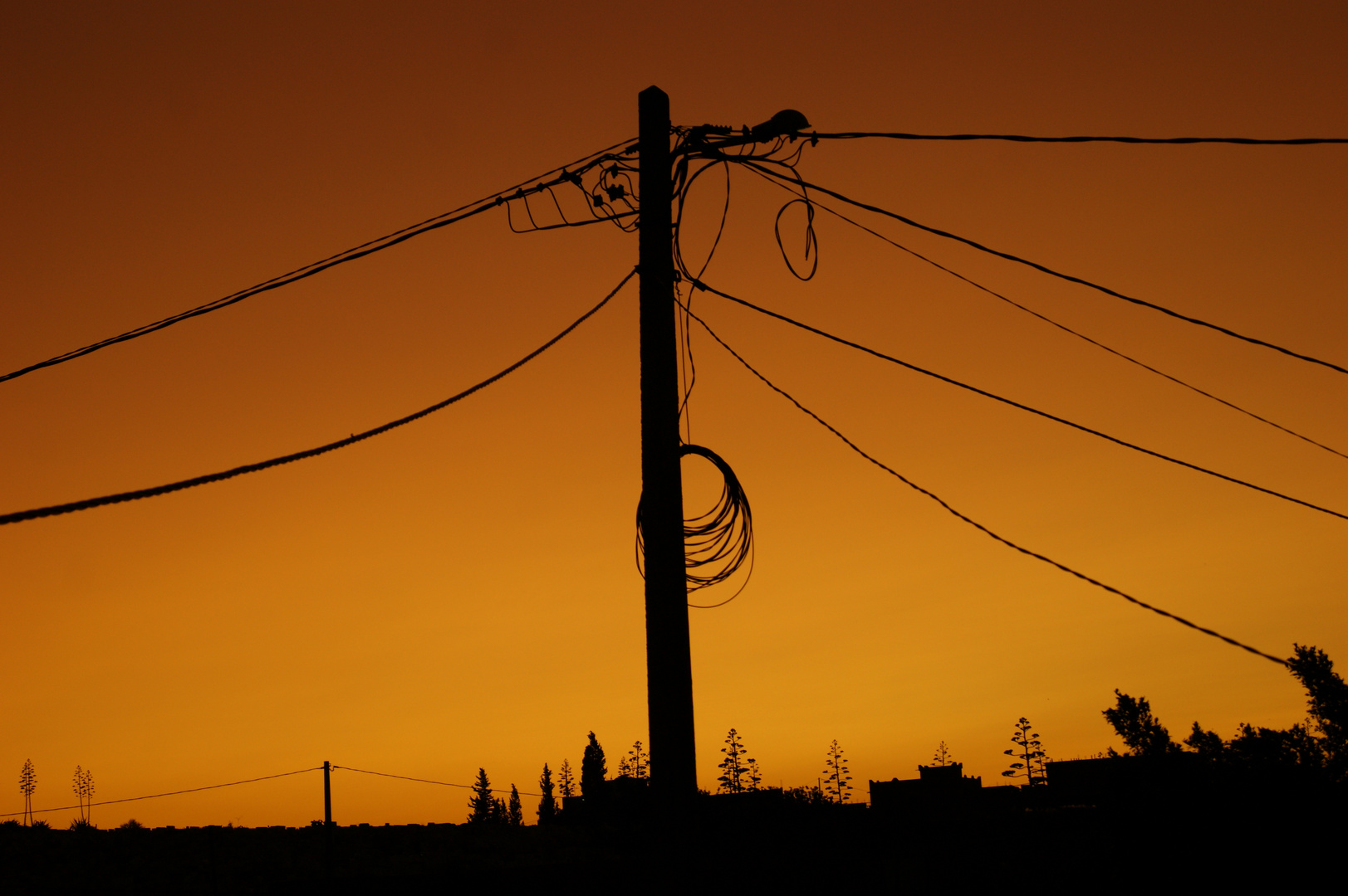 Strommast im Sonnenuntergang