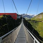 Stubnerkogel - Hängebrücke im Hintergrund die hohen Tauern