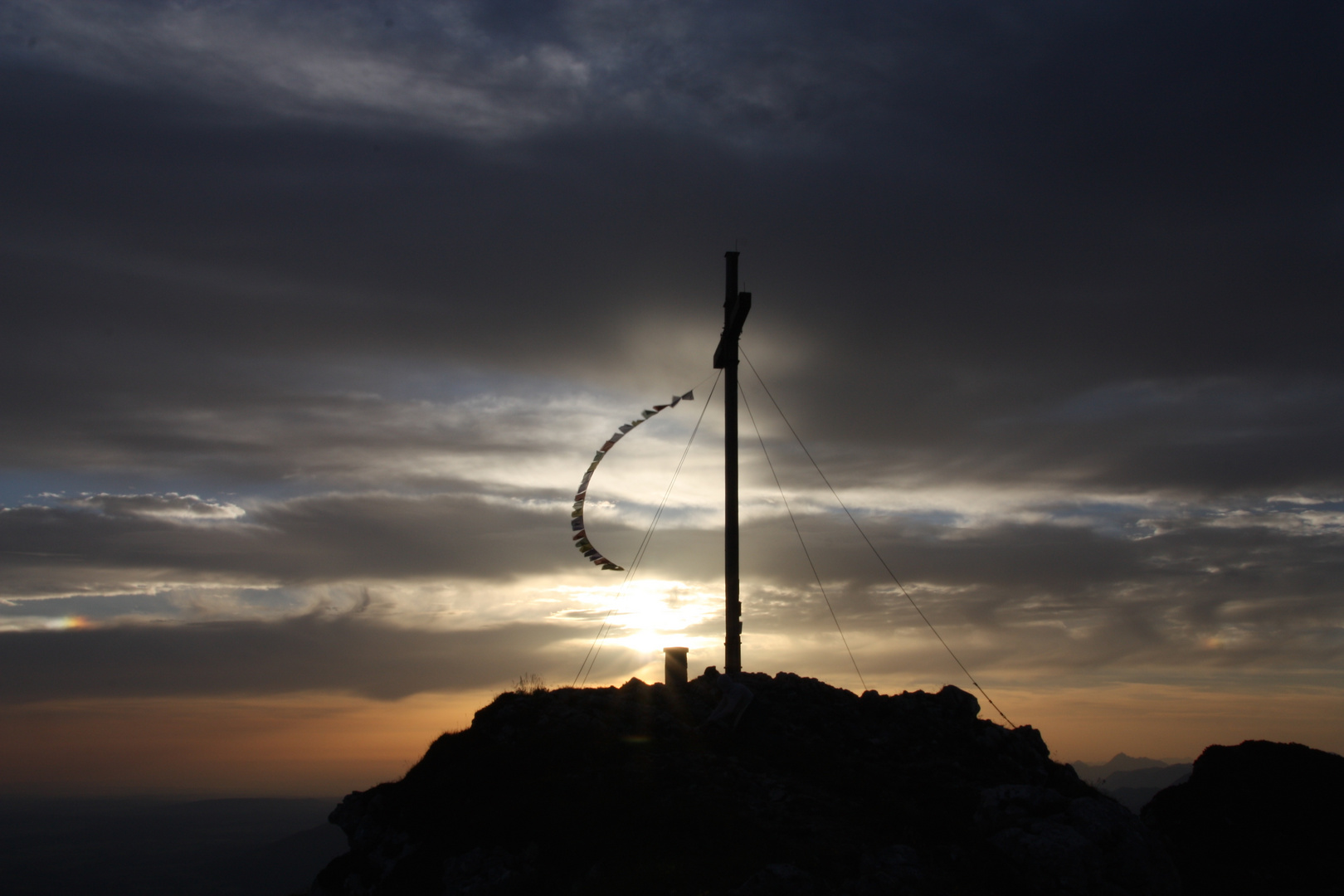 Summit cross and sunrise