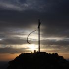 Summit cross and sunrise