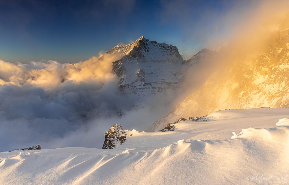 SUN, CLOUDS AND SNOW