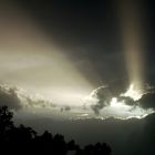 Sun rays from behind the dark clouds