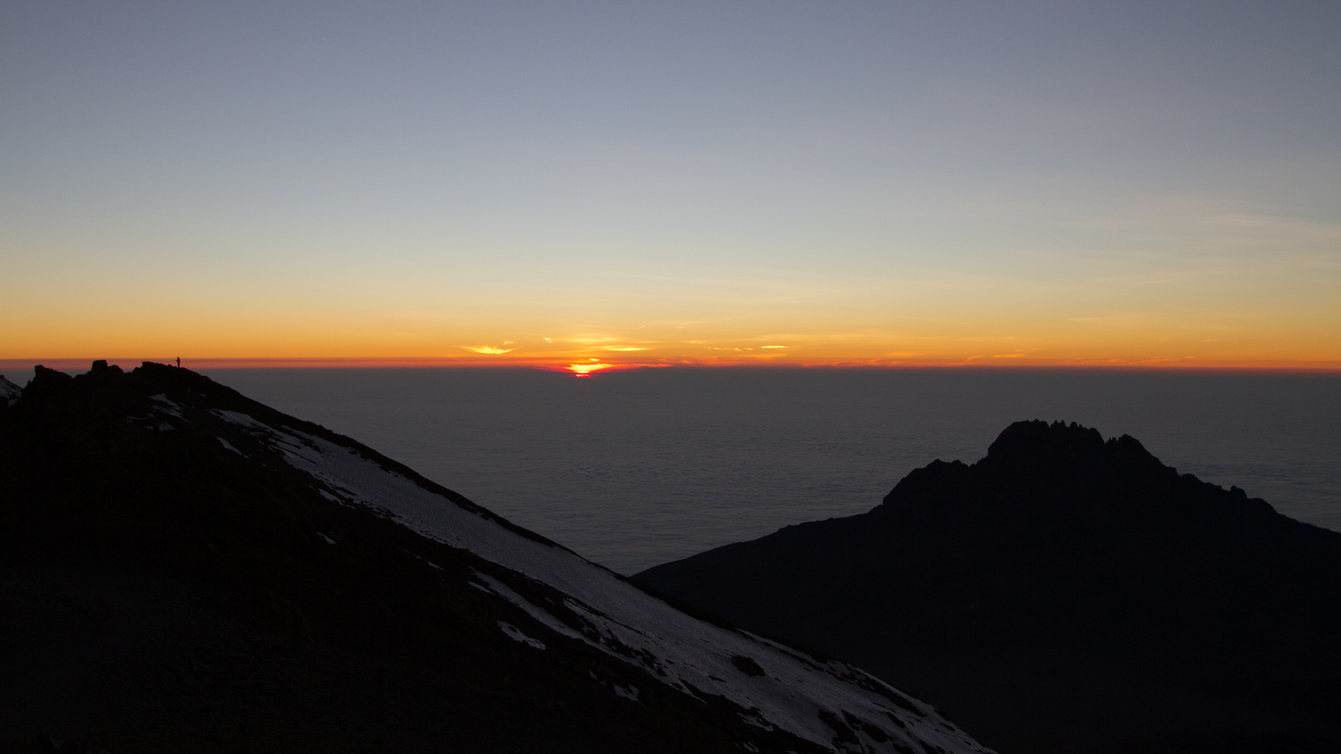 Sun Rise, the lonely hiker and the summit of Africa