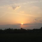 SUN RISE WITH CLOUDS AND CONTRAILS