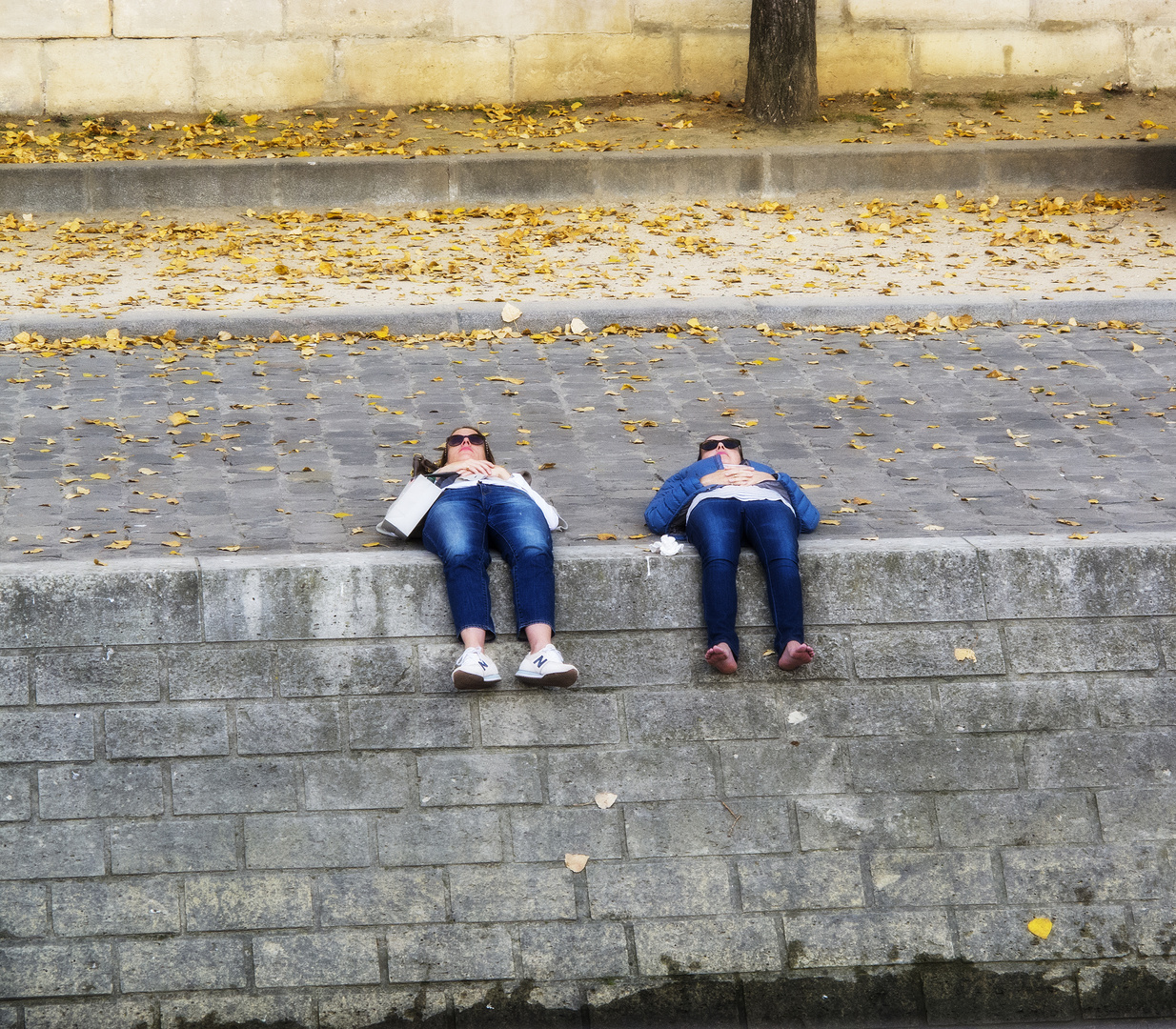 Sunbathing on the banks of the Seine.