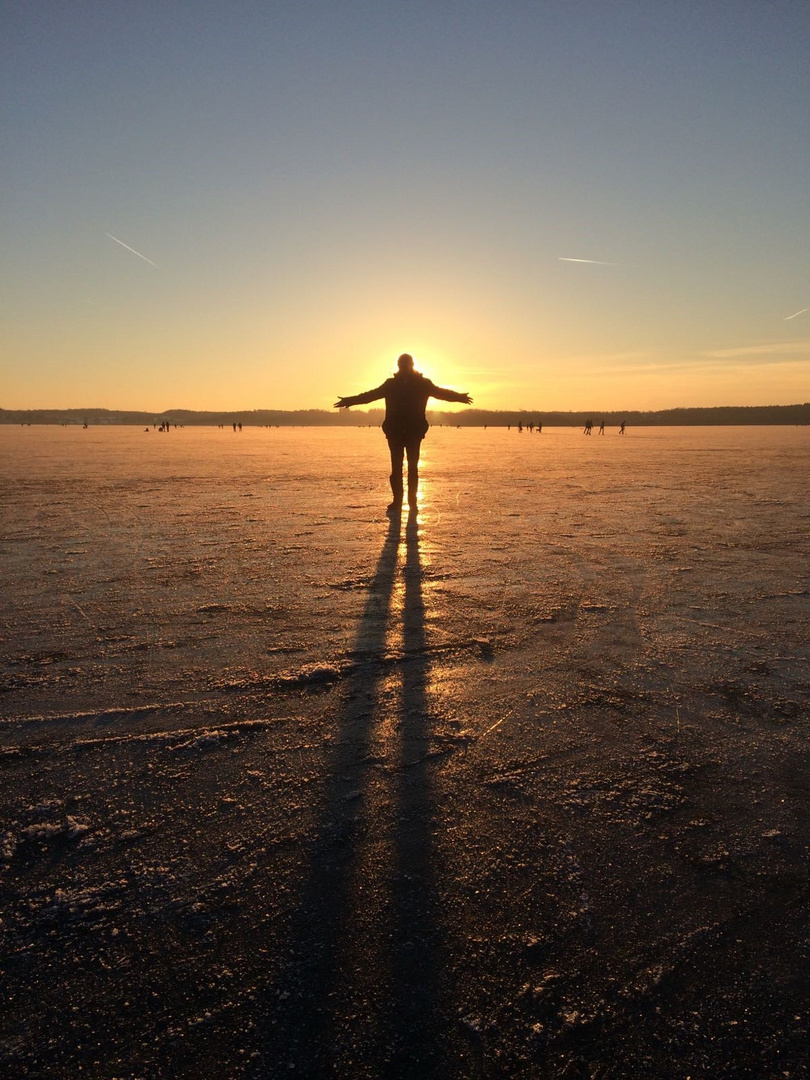 Sundown on a frozen lake