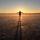 Sundown on a frozen lake