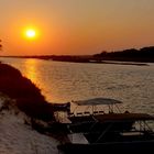 Sundowner über dem Okavango River....