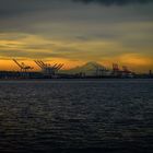 Sunrise behind Seattle and Mount Rainier