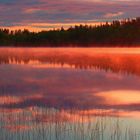 Sunrise on a misty lake