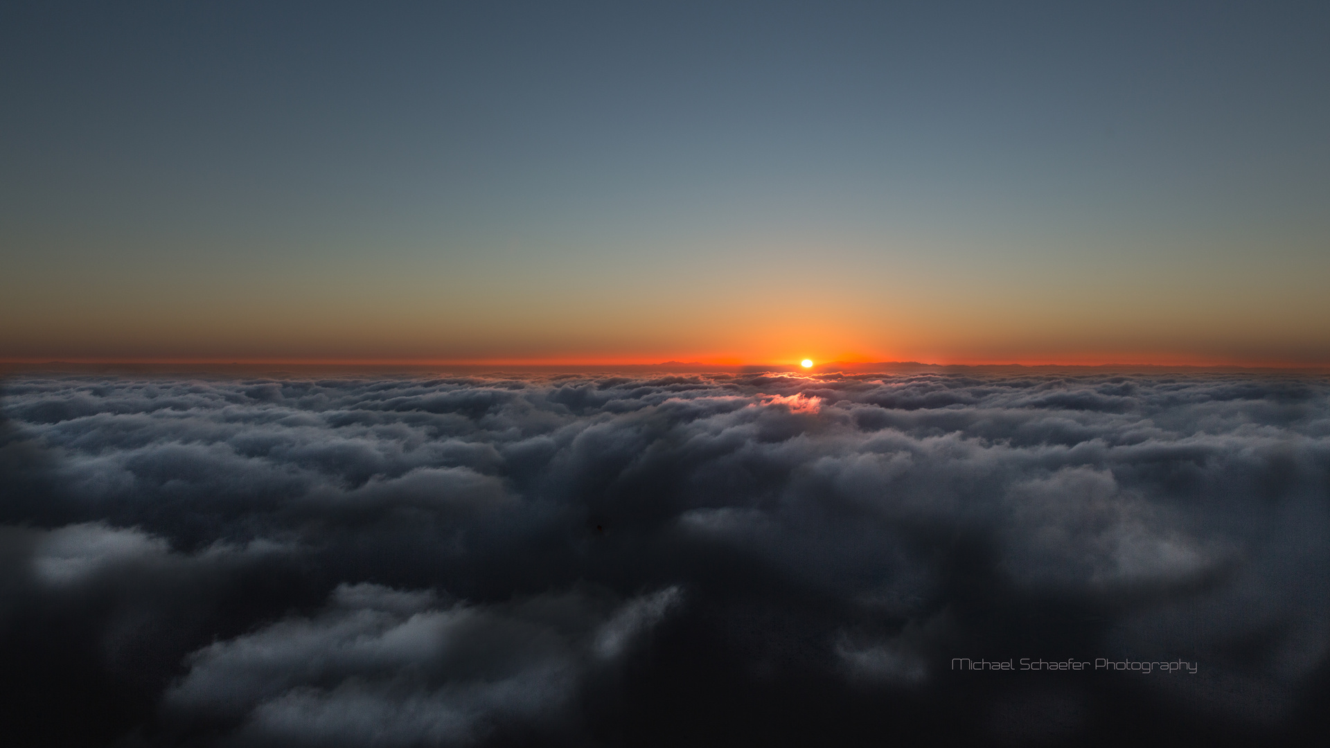 Sunrise over the clouds