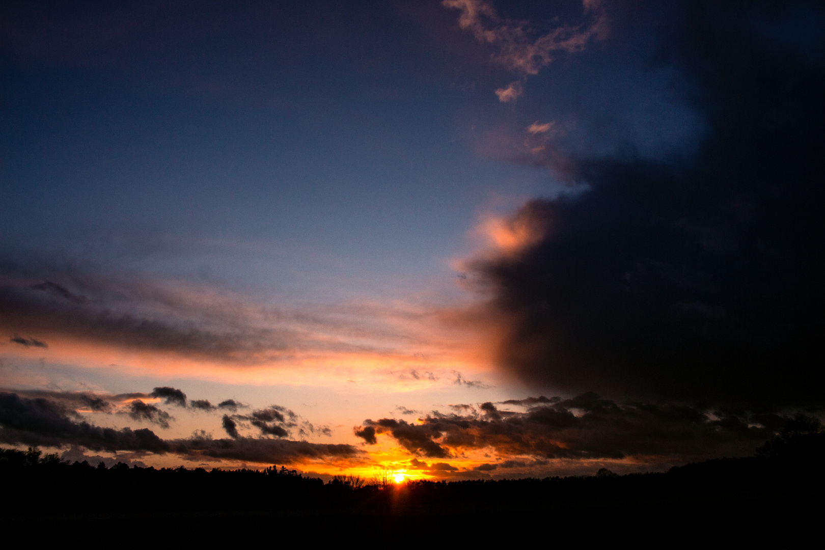 Sunset And Dark Clouds