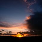 Sunset And Dark Clouds