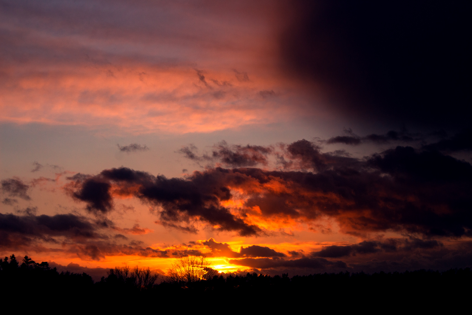 Sunset And Dark Clouds