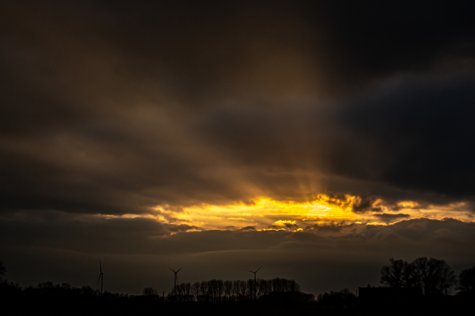 Sunset And Dark Clouds