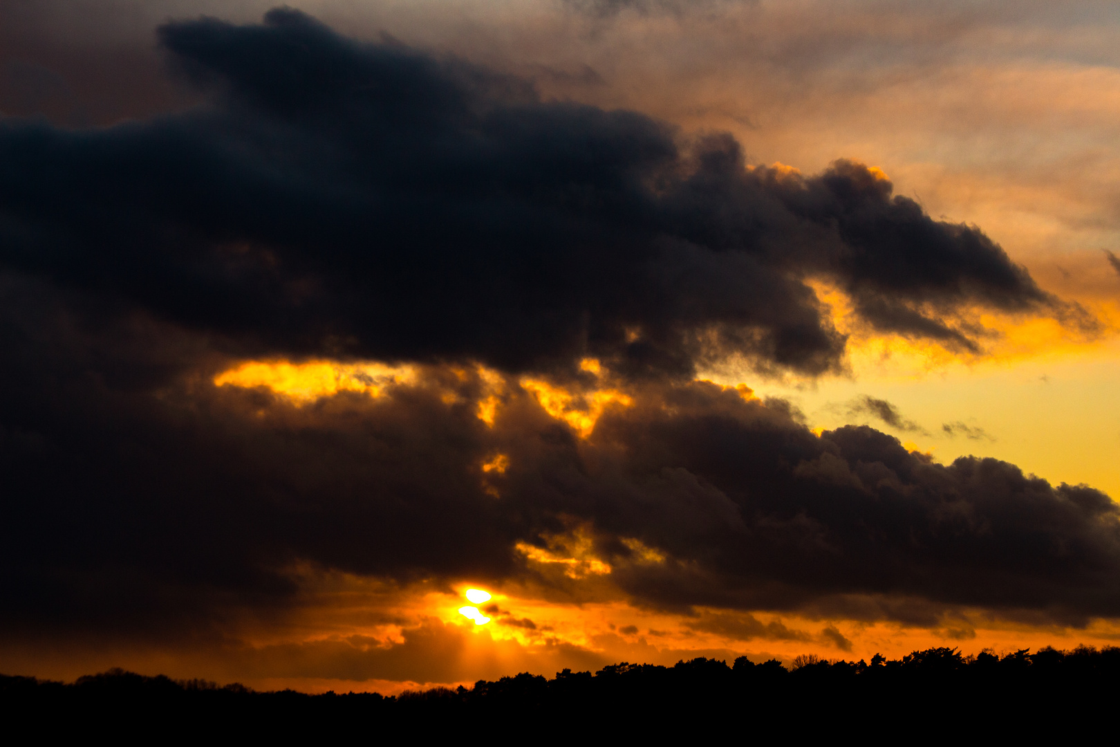 Sunset And Dark Clouds