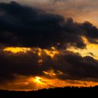 Sunset And Dark Clouds