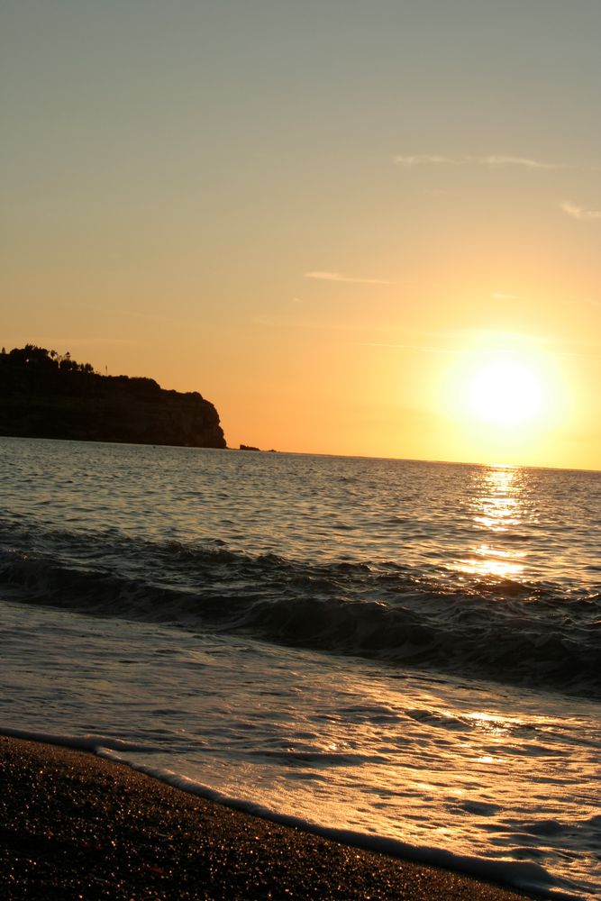 Sunset at empty beach of Tropea