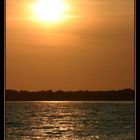 sunset at fjord crossing with a little ferry