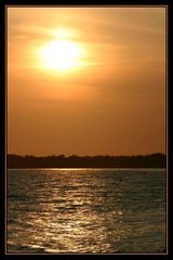 sunset at fjord crossing with a little ferry