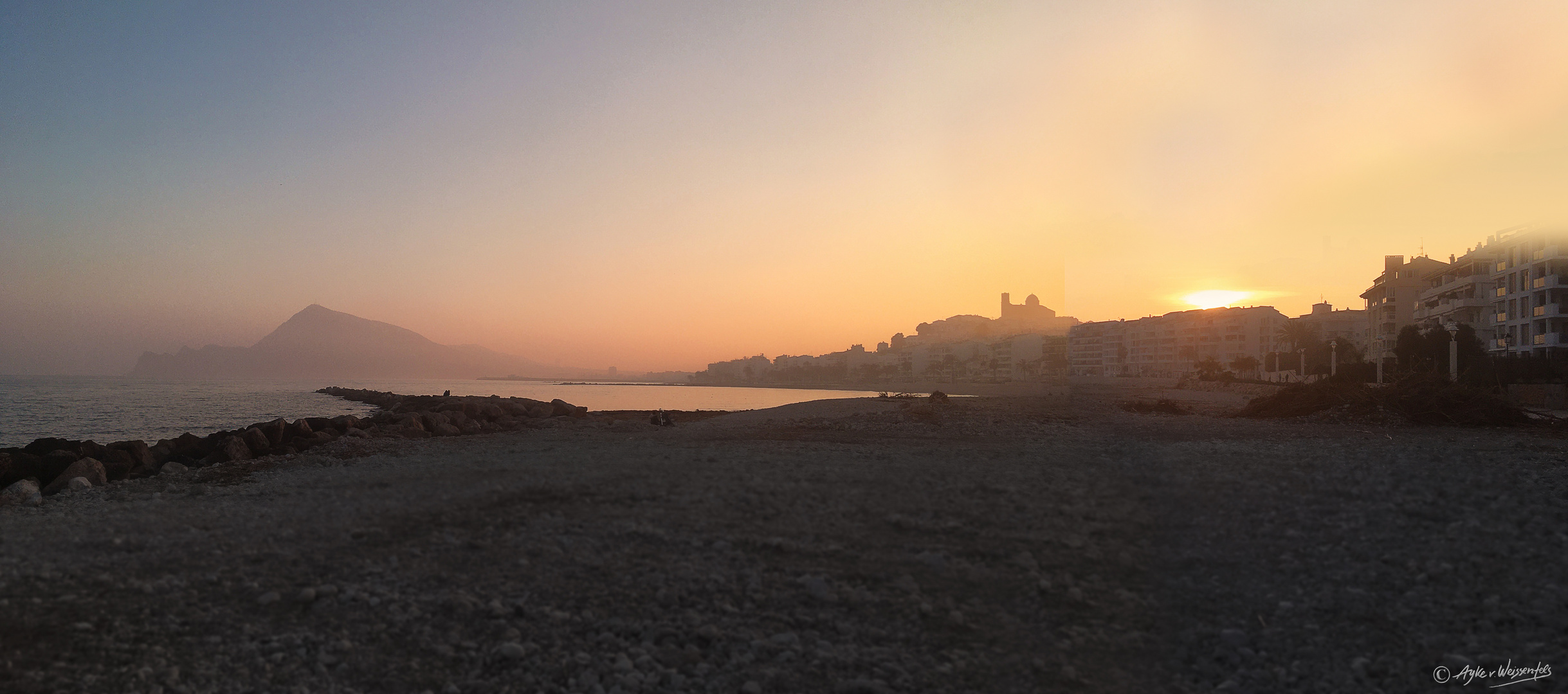 "Sunset at hazy Beach"