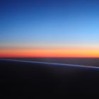 Sunset by travel over the clouds