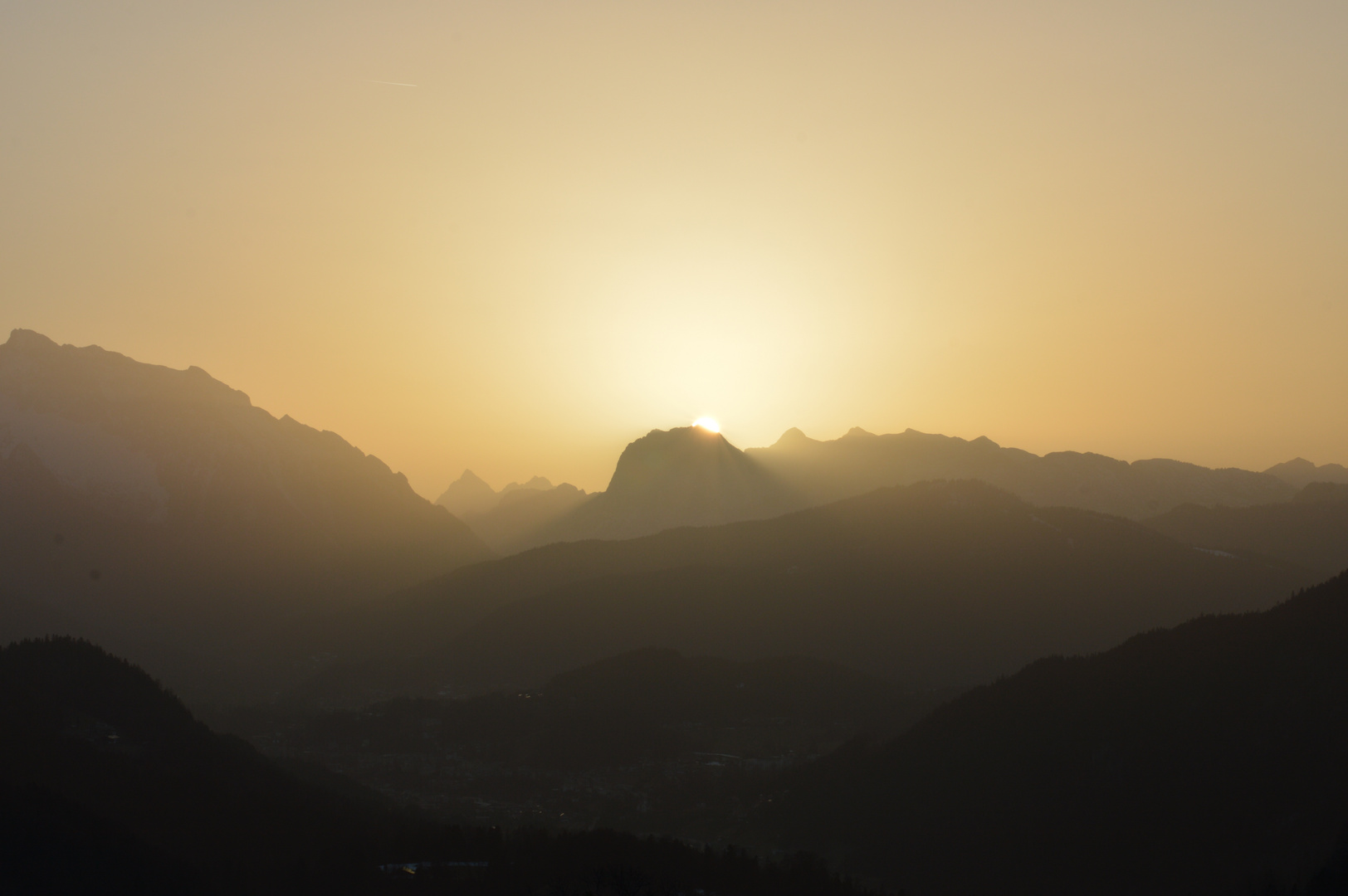 Sunset in the Alps shining trough the sand from Sahara 