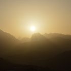 Sunset in the Alps shining trough the sand from Sahara 