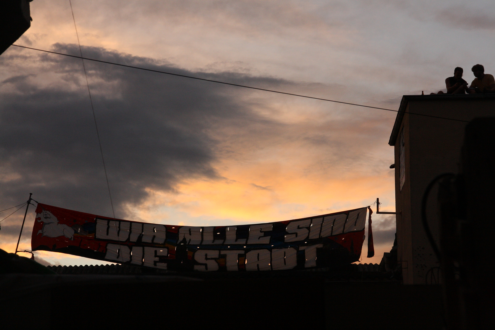 sunset over an occupied house