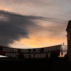 sunset over an occupied house