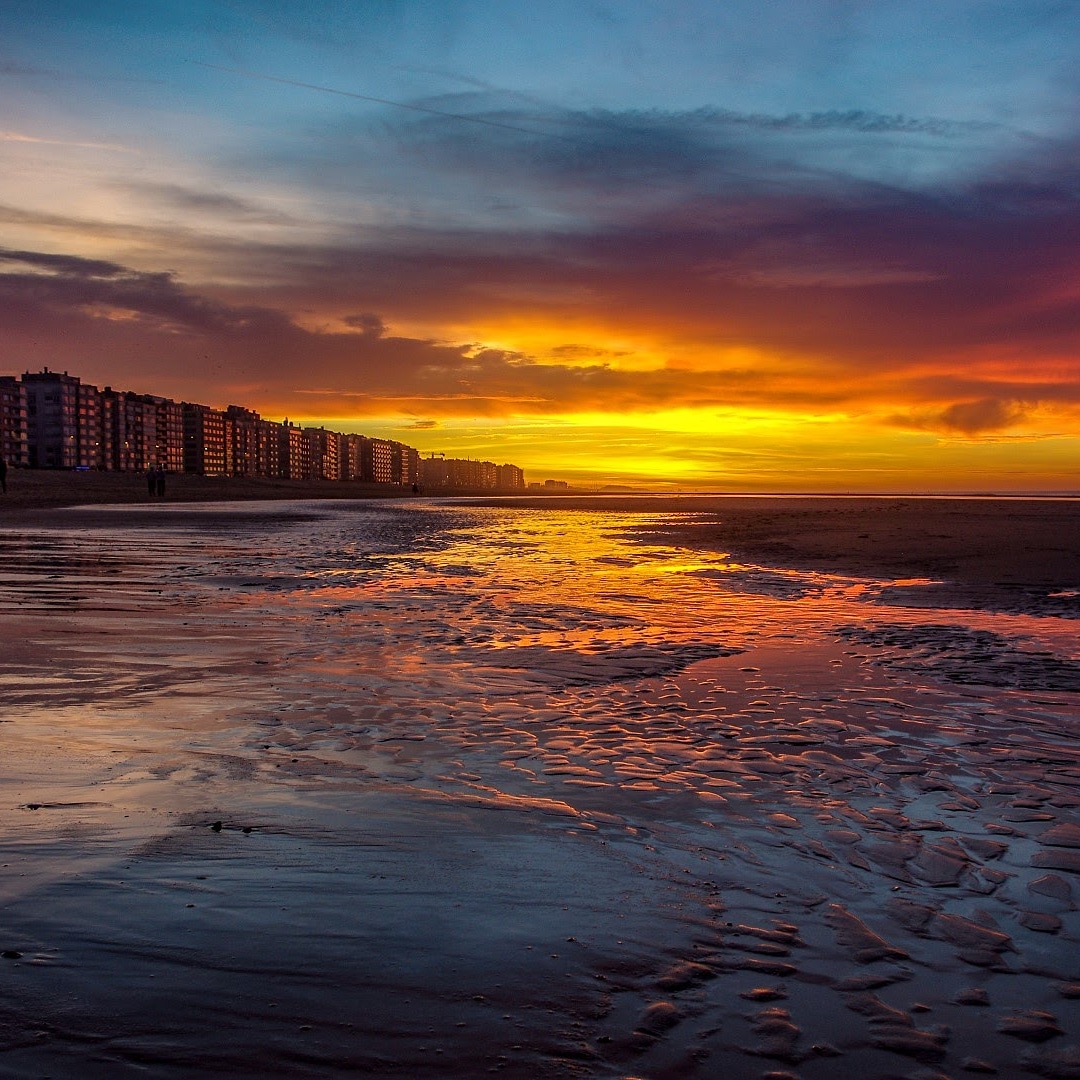 Sunset over Ostend beach after the storm 