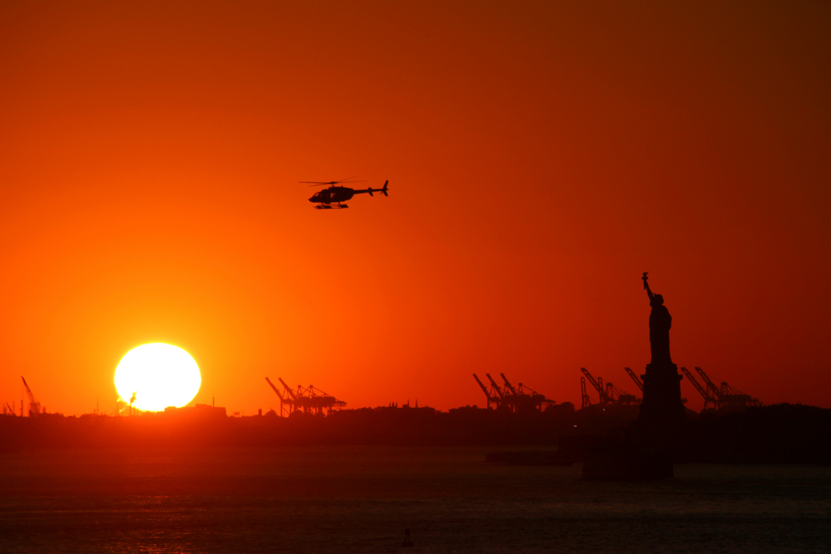 Sunset over Statue of Liberty, New York City