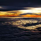 Sunset over the clouds