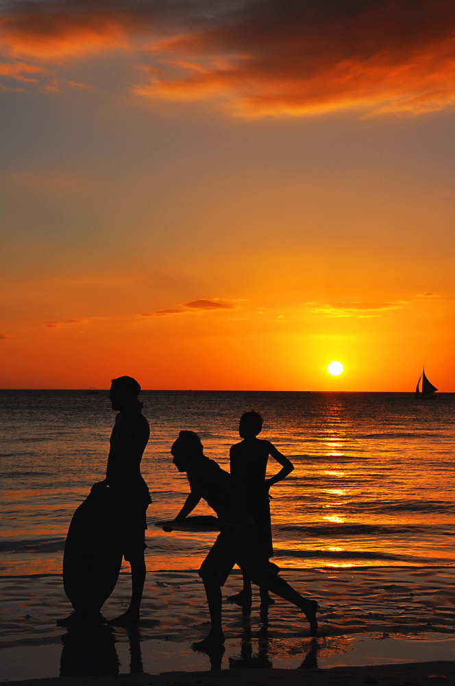 sunset with surfers