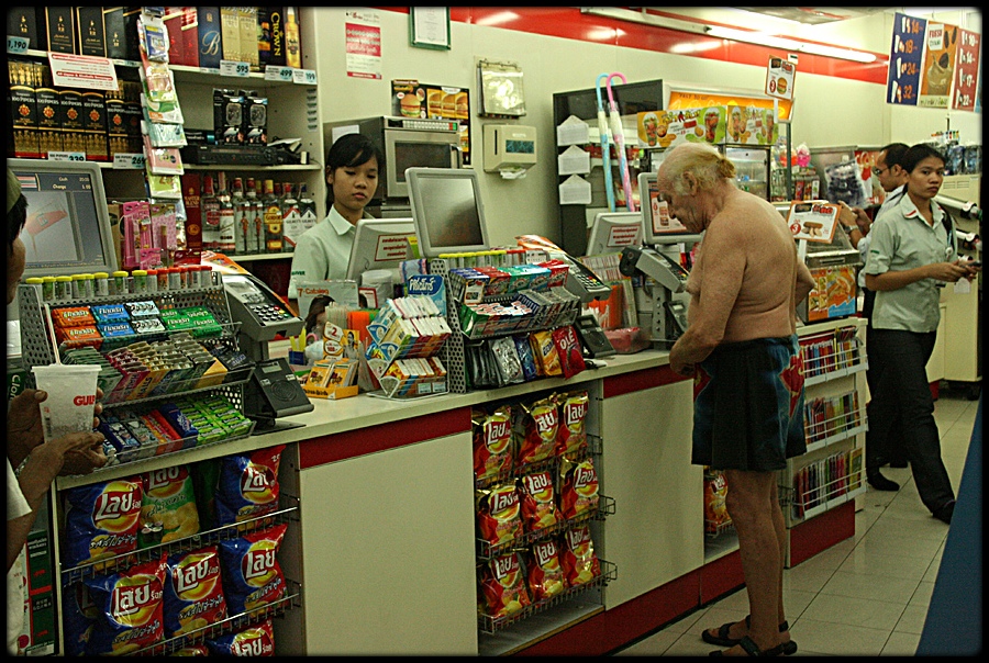 Superman on shopping tour in Seven Eleven in Banglampoo, Bangkok