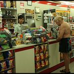 Superman on shopping tour in Seven Eleven in Banglampoo, Bangkok