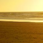 Surfer am Praia do Amado in Portugal