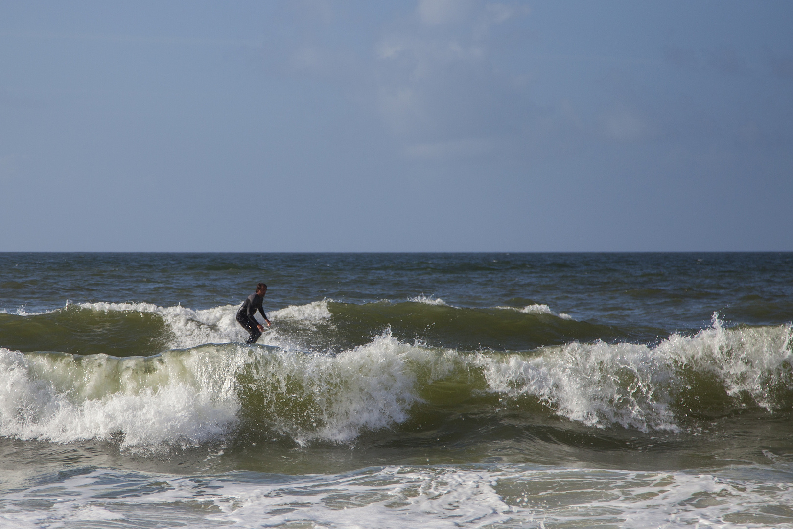 Surfer auf Sylt Richtung Westen