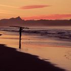 Surfer bei Sonnenuntergang